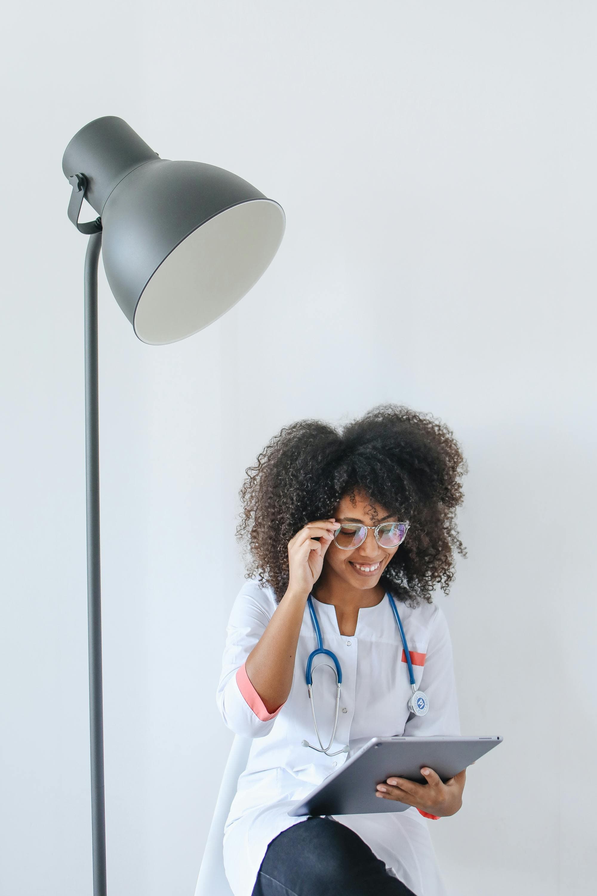 Healthcare worker using TamamHealth digital health records on a tablet