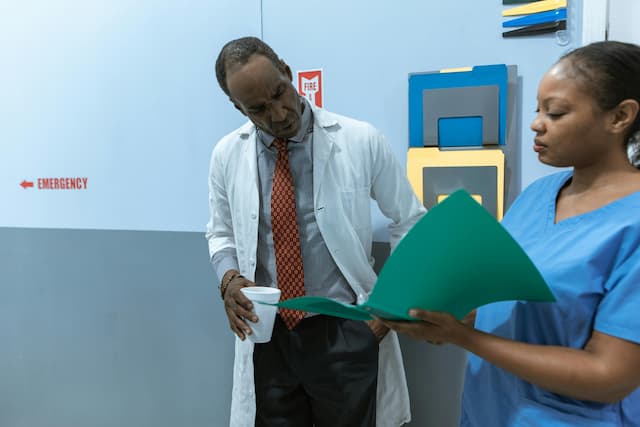 Doctor and nurse reviewing pharmacy orders